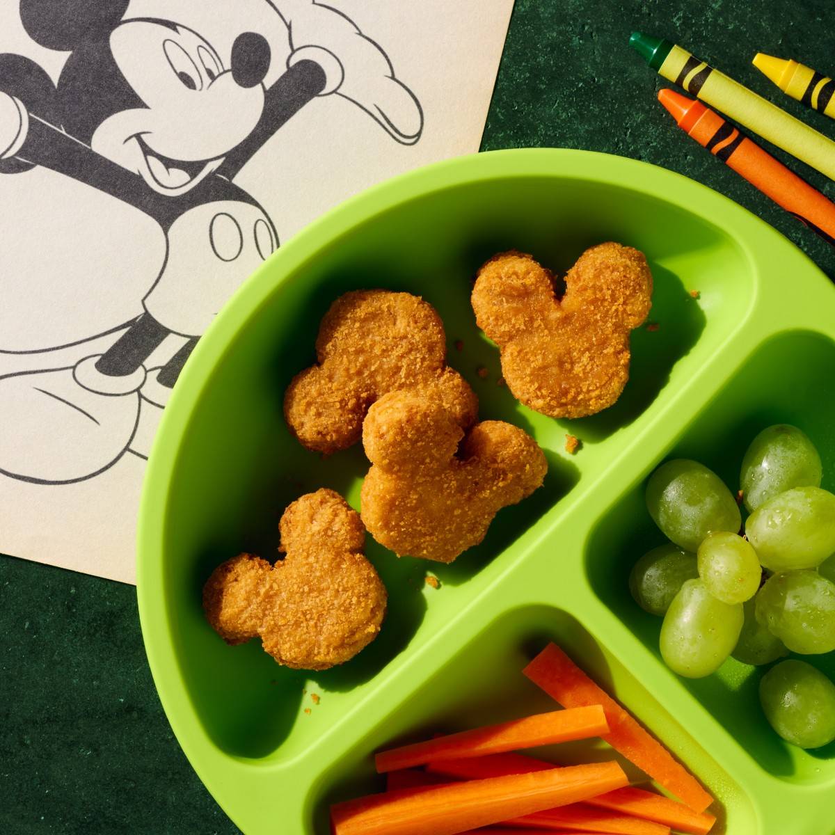 Mickey Mouse Chikn Nuggets on a plate.