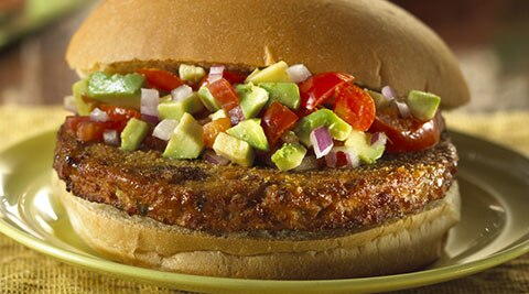 A Morningstar Farms Spicy Black Bean Burger sits on a plate.